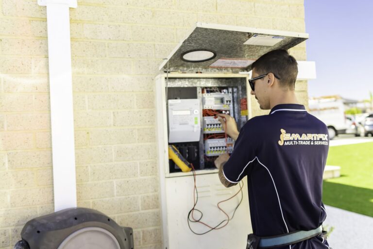 Smartfix electrician working on a switchboard at a Perth home