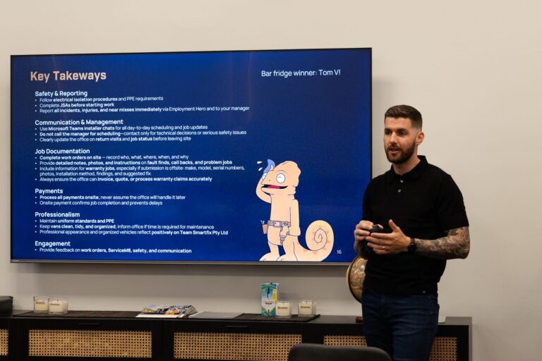 Kane Tyler Smith presenting key takeaways to the Smartfix team