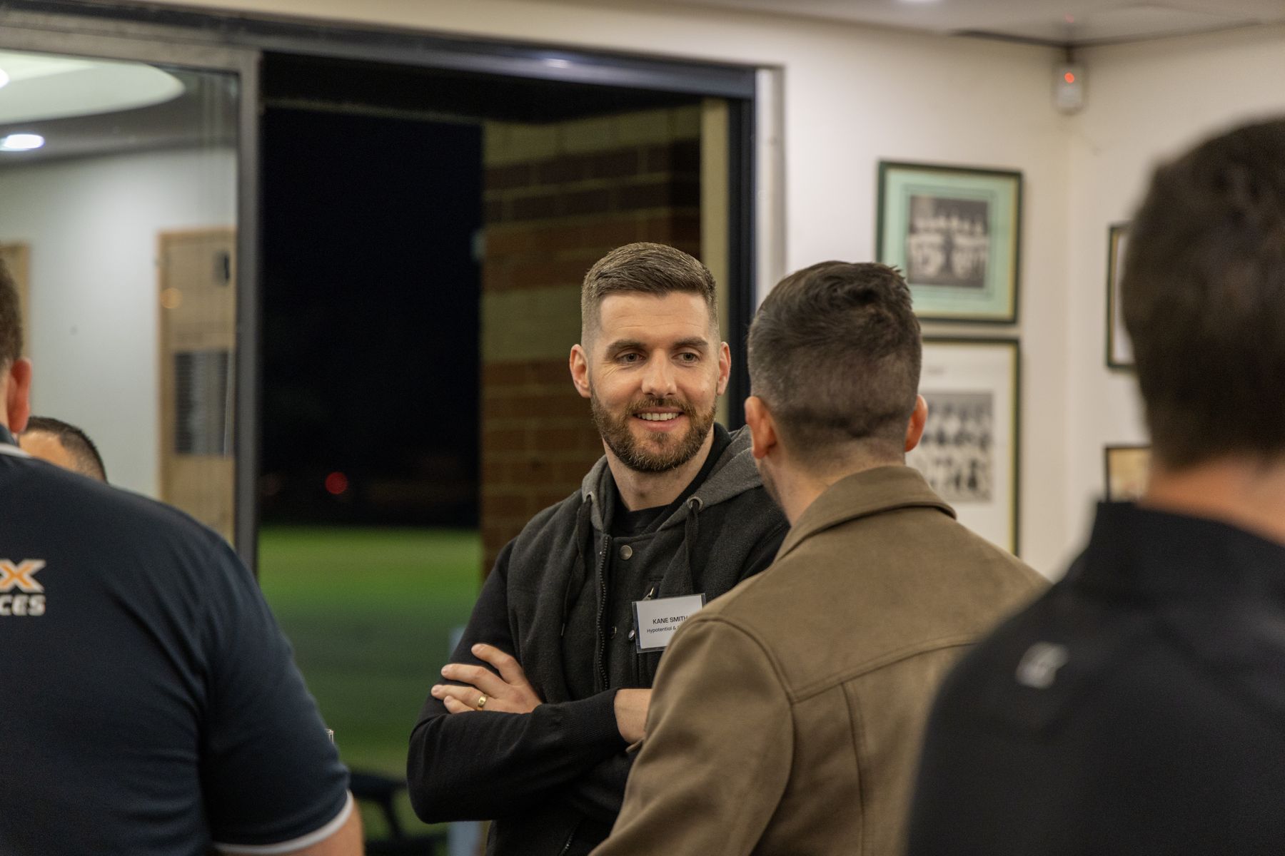 Business coaching for tradies: Kane Tyler Smith talking with trade business owners at a Hypotential networking night in Perth